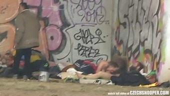 A Homeless Couple Engages In A Threesome In Public, Caught On Camera By A Curious Onlooker