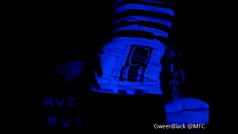 Dancing Provocatively In Black Light With His Buttocks On Display